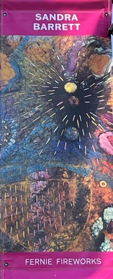 A close up of the sun and stars in a painting