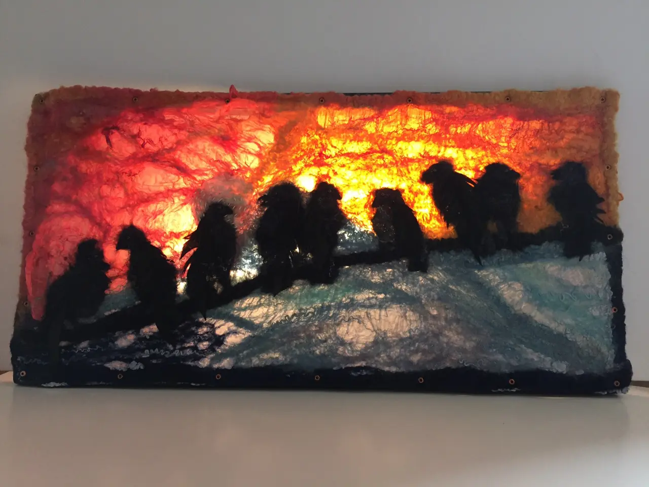 A painting of a group of people on the beach.