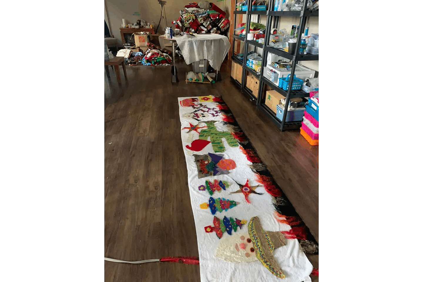 A long table with a large quilt on it