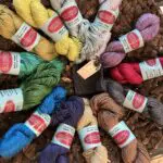 A group of yarn is sitting in a circle.